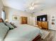 Comfortable main bedroom showcasing natural light, and generous closet space, offering a tranquil retreat at 3551 Mulberry Grove Loop, Leesburg, FL 34748