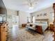 A well-lit main bedroom with plenty of space for furniture at 3551 Mulberry Grove Loop, Leesburg, FL 34748