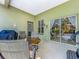 Enclosed patio area featuring outdoor seating and a grill at 3551 Mulberry Grove Loop, Leesburg, FL 34748