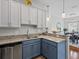 Modern kitchen with stainless steel dishwasher, granite counters, and pendant lighting at 3656 Solana Cir # A, Clermont, FL 34711