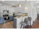 Well-lit kitchen boasts modern appliances, stylish countertops, and a breakfast bar at 3656 Solana Cir # A, Clermont, FL 34711