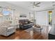 Inviting living room features a plush sofa, stylish decor, and plenty of natural light at 3656 Solana Cir # A, Clermont, FL 34711