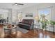 Relaxing living area features hardwood floors, a modern ceiling fan, and cozy furniture at 3656 Solana Cir # A, Clermont, FL 34711