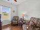 Inviting living room with patterned armchairs and a view from the window at 3656 Solana Cir # A, Clermont, FL 34711