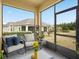 Enjoy the outdoor living space of this screened patio with comfortable seating at 3656 Solana Cir # A, Clermont, FL 34711