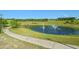 Picturesque pond with fountains and a walking path at 3656 Solana Cir # A, Clermont, FL 34711
