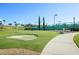 Putting green with a sand trap at 3656 Solana Cir # A, Clermont, FL 34711