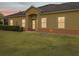 A quaint home exterior features a covered entrance and neatly trimmed shrubs at 3656 Solana Cir # A, Clermont, FL 34711