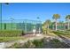 Tennis courts with green fencing, offering a great outdoor activity for residents at 3656 Solana Cir # A, Clermont, FL 34711