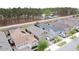 Aerial view of the neighborhood's charming single-Gathering homes and tree lined backyard privacy at 368 Alcove Dr, Groveland, FL 34736