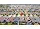An aerial view of a serene neighborhood with a community lake and well-maintained houses at 368 Alcove Dr, Groveland, FL 34736