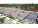 Aerial view showcasing houses in the neighborhood backing to a picturesque tree line at 368 Alcove Dr, Groveland, FL 34736
