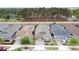 An aerial shot showcasing a single-Gathering home with a well-maintained lawn and privacy fencing at 368 Alcove Dr, Groveland, FL 34736