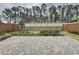 Backyard hardscape featuring a paver patio and landscaping with privacy fence at 368 Alcove Dr, Groveland, FL 34736