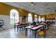 A bright and spacious craft room with large windows, perfect for creative projects and hobbies at 368 Alcove Dr, Groveland, FL 34736