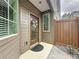 A welcoming entryway features a decorative door, small plants, and neutral paint at 368 Alcove Dr, Groveland, FL 34736