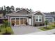 Charming home featuring a brick-paved driveway, a two-car garage and tidy landscaping at 368 Alcove Dr, Groveland, FL 34736