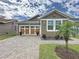 Charming single-story home featuring a two-car garage, well-maintained lawn and landscaped garden at 368 Alcove Dr, Groveland, FL 34736
