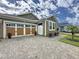 Charming single-story home featuring a two-car garage, well-maintained lawn and landscaped garden at 368 Alcove Dr, Groveland, FL 34736