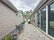 Outdoor patio area with paved bricks and comfortable seating at 368 Alcove Dr, Groveland, FL 34736