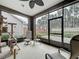 Relaxing screened patio with view of the backyard and comfortable seating area at 368 Alcove Dr, Groveland, FL 34736