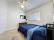 Bright bedroom with a bed, TV and natural light from the window at 3684 Eversholt St, Clermont, FL 34711