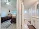 An interior view showcasing a bedroom and bathroom that are both spacious and well-lit at 3684 Eversholt St, Clermont, FL 34711