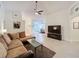 Cozy living room with tile floors, artwork, and plenty of space at 3684 Eversholt St, Clermont, FL 34711