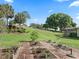 Expansive backyard featuring lush landscaping and serene views at 39023 Griffin Lndg, Lady Lake, FL 32159