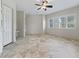 Bright and airy bedroom with tile floors, a large window, and neutral colors, creating a serene retreat at 39023 Griffin Lndg, Lady Lake, FL 32159