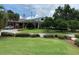 View of the clubhouse with lush landscaping at 39023 Griffin Lndg, Lady Lake, FL 32159