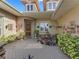 Inviting front entrance with a decorative fountain, stonework, and lush plantings, creating a welcoming ambiance at 39023 Griffin Lndg, Lady Lake, FL 32159