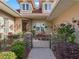 Inviting front entrance with a decorative fountain, stonework, and lush plantings, creating a welcoming ambiance at 39023 Griffin Lndg, Lady Lake, FL 32159