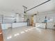 Spacious garage with ample cabinet storage and workbench areas at 39023 Griffin Lndg, Lady Lake, FL 32159