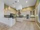 Gourmet kitchen with stainless steel appliances, custom cabinetry, and a center island for culinary enthusiasts at 39023 Griffin Lndg, Lady Lake, FL 32159