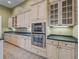 Spacious kitchen with custom cabinets, countertops, and stainless steel double ovens at 39023 Griffin Lndg, Lady Lake, FL 32159