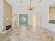 Bright living room features tile flooring, a brick fireplace, and an open layout for seamless entertaining at 39023 Griffin Lndg, Lady Lake, FL 32159