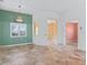 Open living room with tile floors, arched doorways, and a view into adjacent rooms at 39023 Griffin Lndg, Lady Lake, FL 32159