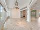 Bright living space featuring tile floors, large windows and a fireplace at 39023 Griffin Lndg, Lady Lake, FL 32159