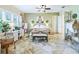 Stylishly decorated main bedroom featuring tile floors, green walls, a desk, and a well-lit vanity at 39023 Griffin Lndg, Lady Lake, FL 32159