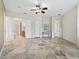 Spacious main bedroom featuring tile floors and a seamless transition to the en-suite bathroom and closet at 39023 Griffin Lndg, Lady Lake, FL 32159