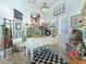 Charming room with piano, decor, checkered rug, light fixture and a window at 39023 Griffin Lndg, Lady Lake, FL 32159