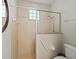 This shower features a glass block window, safety bar, and tiled walls at 39023 Griffin Lndg, Lady Lake, FL 32159