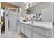 Bright bathroom features a walk-in shower, skylight, and a single sink vanity at 4717 Inverness Dr, Leesburg, FL 34748