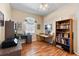 Functional home office with wood floors, natural light, and a built-in bookshelf at 4717 Inverness Dr, Leesburg, FL 34748