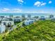 Distant aerial view of a condo community near the beach, surrounded by landscaping and ponds at 5300 S Atlantic Ave # 16-202, New Smyrna Beach, FL 32169