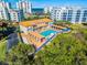 Aerial view of the community pool area and amenity spaces with nearby ocean views at 5300 S Atlantic Ave # 16-202, New Smyrna Beach, FL 32169