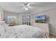Bright bedroom with a large window, desk, and dresser, creating a relaxing space at 5300 S Atlantic Ave # 16-202, New Smyrna Beach, FL 32169