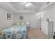 Bright bedroom with a quilt-covered bed, neutral-toned walls, and coordinated furnishings at 5300 S Atlantic Ave # 16-202, New Smyrna Beach, FL 32169