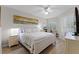 Relaxing bedroom with wood floors, a desk, and a comfortable bed at 5300 S Atlantic Ave # 16-202, New Smyrna Beach, FL 32169